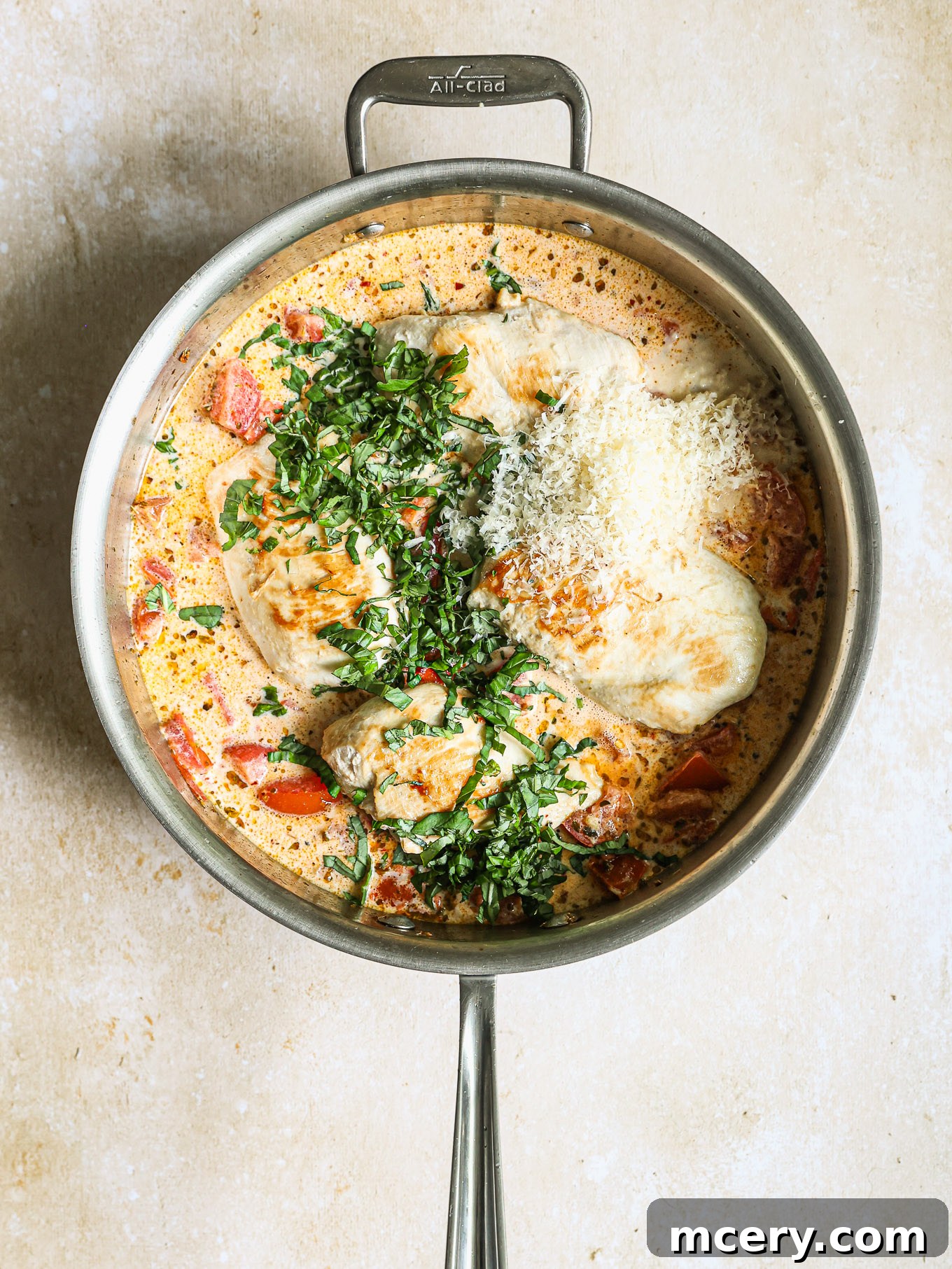 Sun-Kissed Tomato Basil Chicken 7 seared chicken breast in a cream sauce topped with fresh basil and parmesan.