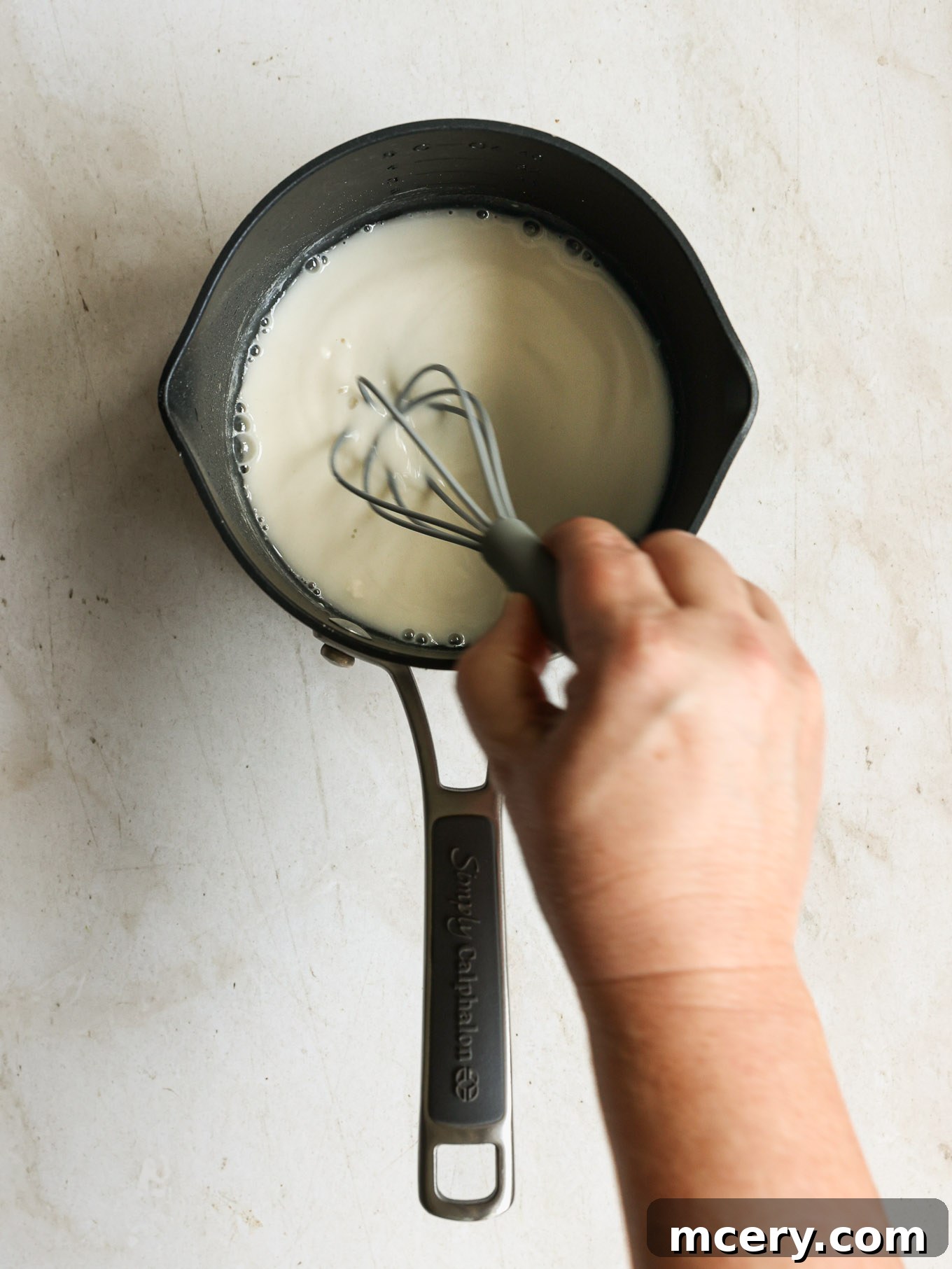 Whip Up Delicious Homemade Chicken Teriyaki 4 Whisking flour and water in a small saucepan to form a slurry for teriyaki sauce.