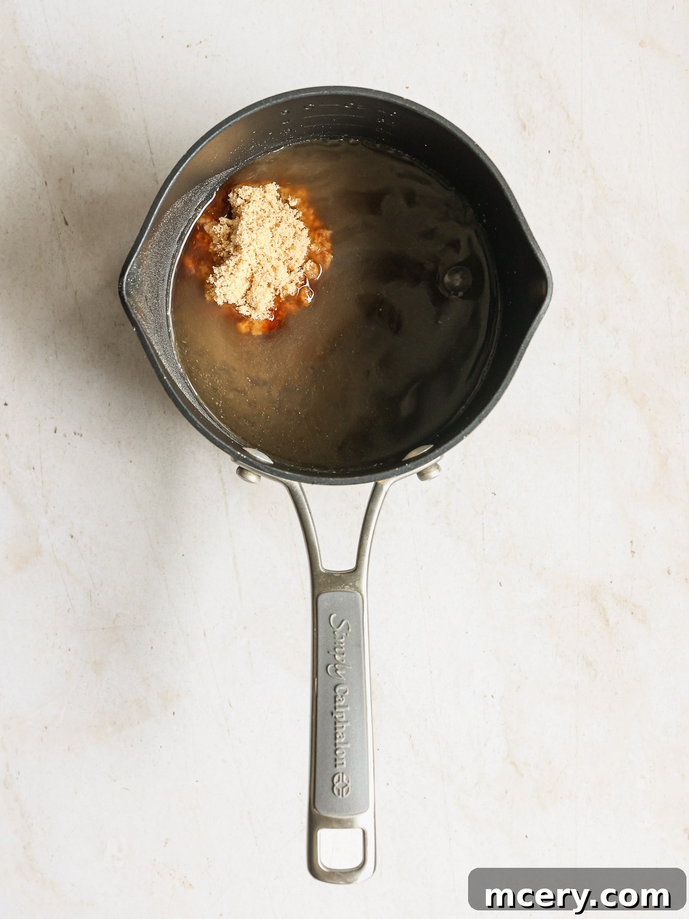 Whip Up Delicious Homemade Chicken Teriyaki 5 Adding brown sugar, soy sauce, and honey to the flour-water mixture in a saucepan.