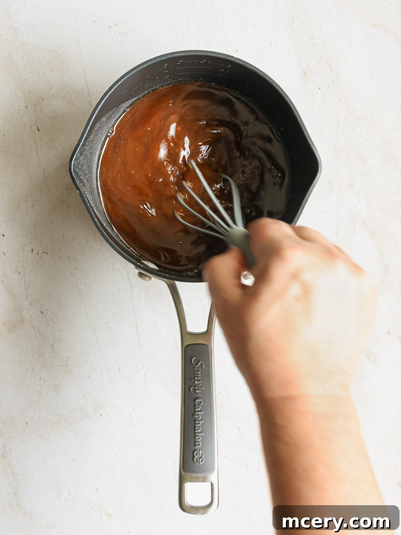 Whip Up Delicious Homemade Chicken Teriyaki 6 Teriyaki sauce simmering and thickening in a saucepan over medium heat.
