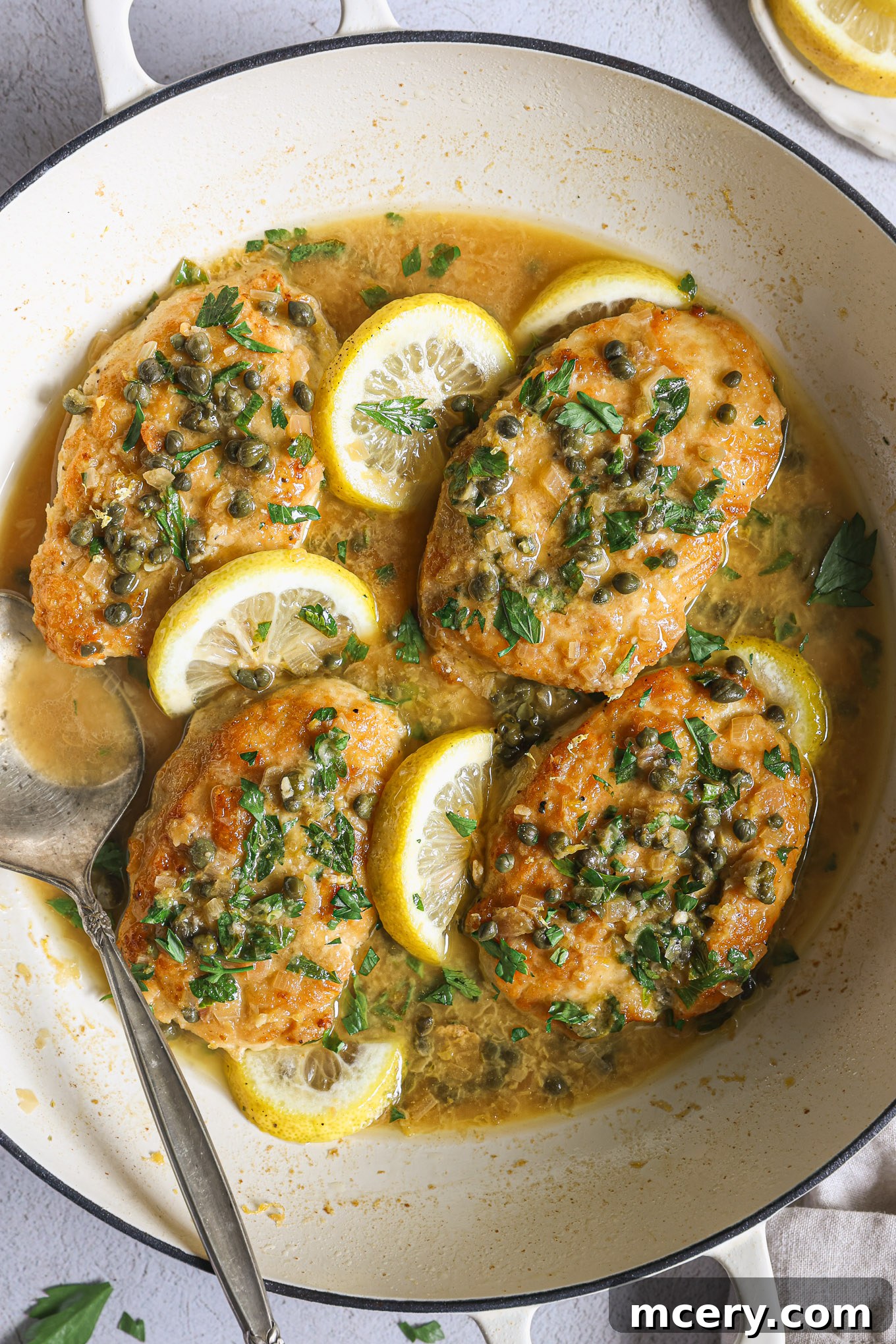 Zesty Lemon Piccata Chicken 12 chicken piccata with sliced lemon slices.