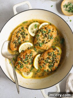 lemon chicken piccata in a skillet.