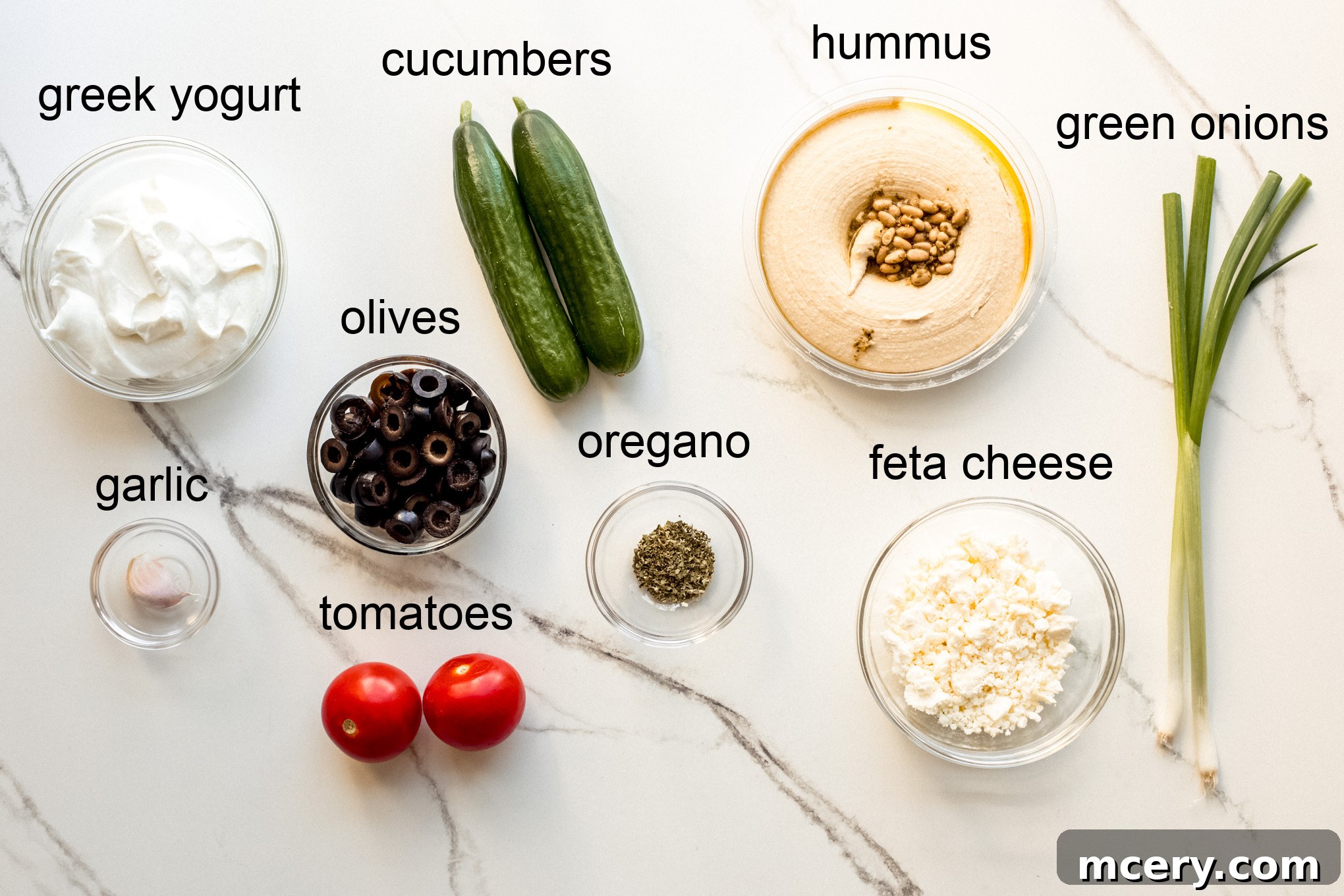 Stacked Hummus Delight 4 Fresh ingredients laid out for making the Greek hummus dip