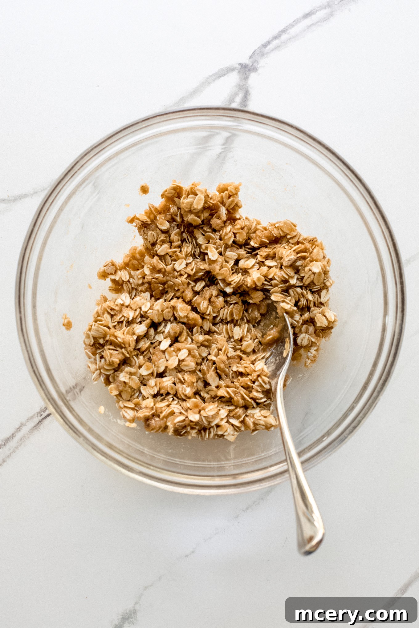 Golden Oat Topped Blueberry Crisp 8 Close-up of the crumbly oat topping in a bowl.