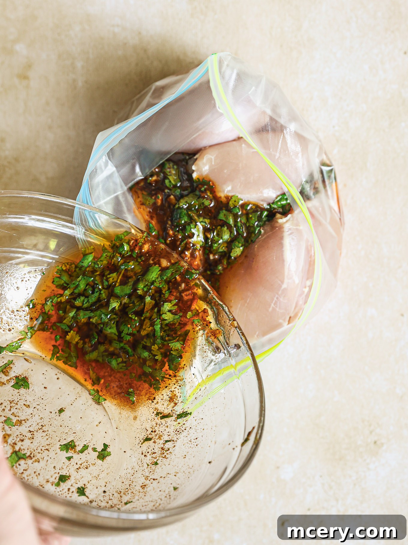 Vibrant Mexican Chicken Marinade 5 chicken covered in marinade inside a ziploc bag.