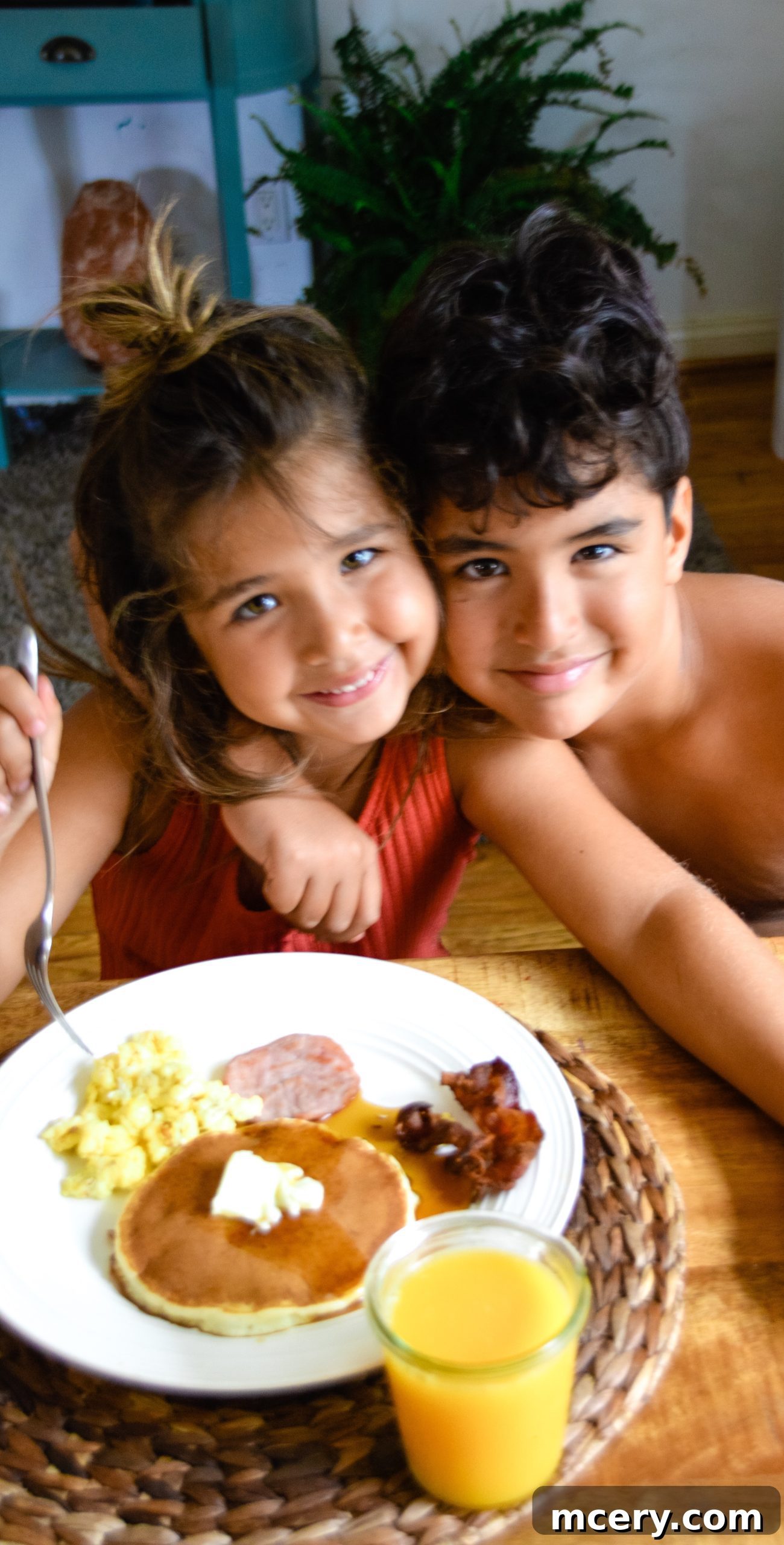 Celebrating Dads 5 A bountiful Father's Day brunch spread featuring pancakes, eggs, bacon, and fresh fruit.