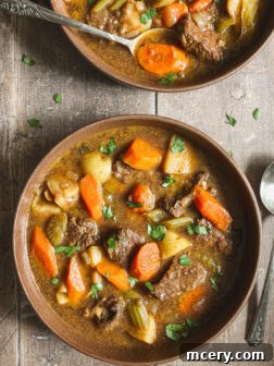 A delicious and inviting bowl of rich Dutch oven beef stew, garnished and ready to be enjoyed.
