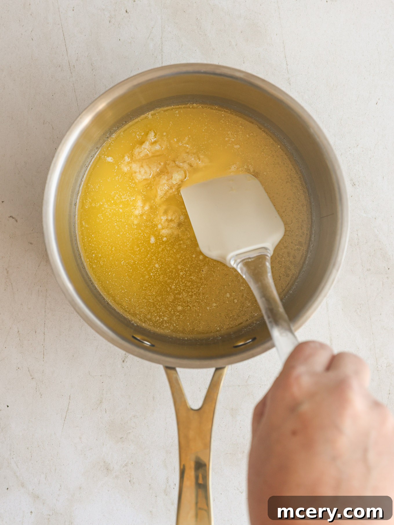 Homemade Alfredo Perfection 4 Melted butter shimmering gently in a saucepan over medium-low heat.