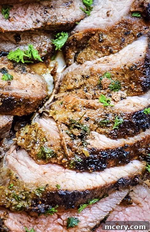 A close-up image illustrating the correct technique for slicing a cooked Tri-Tip roast against the grain.