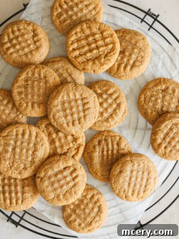 Peanut butter cookies on a cooling rack.