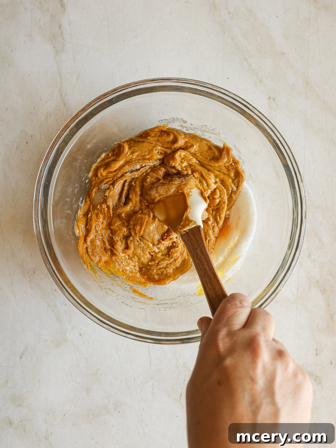 Effortless 4-Ingredient Peanut Butter Cookies 5 The smooth, well-combined peanut butter cookie dough in a mixing bowl after thorough stirring.