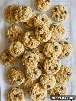 Perfectly baked old fashioned cornflake cookies arranged on parchment paper, ready to be enjoyed.