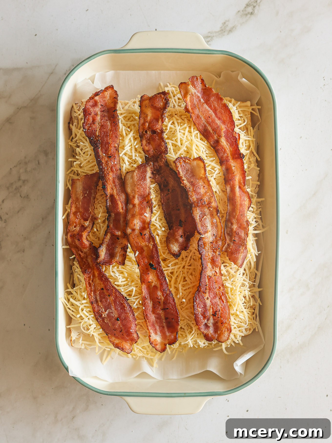 cheese and bacon topped layered on hawaiian rolls.