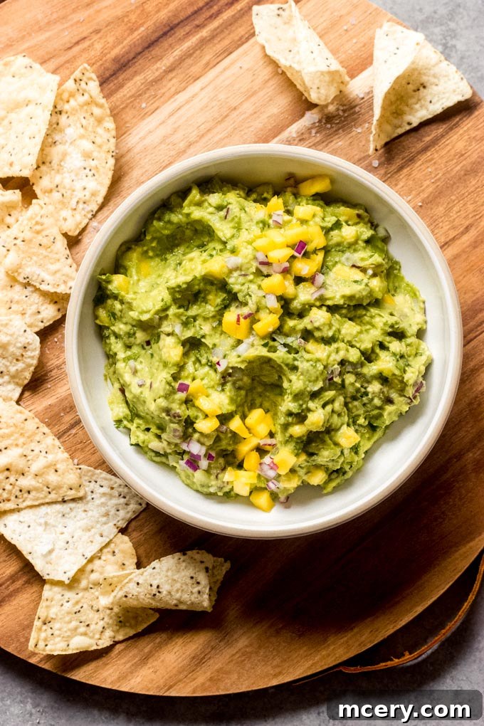 Tropical Mango Guacamole 2 Vibrant mango guacamole in a bowl, perfect for a sweet and savory dip