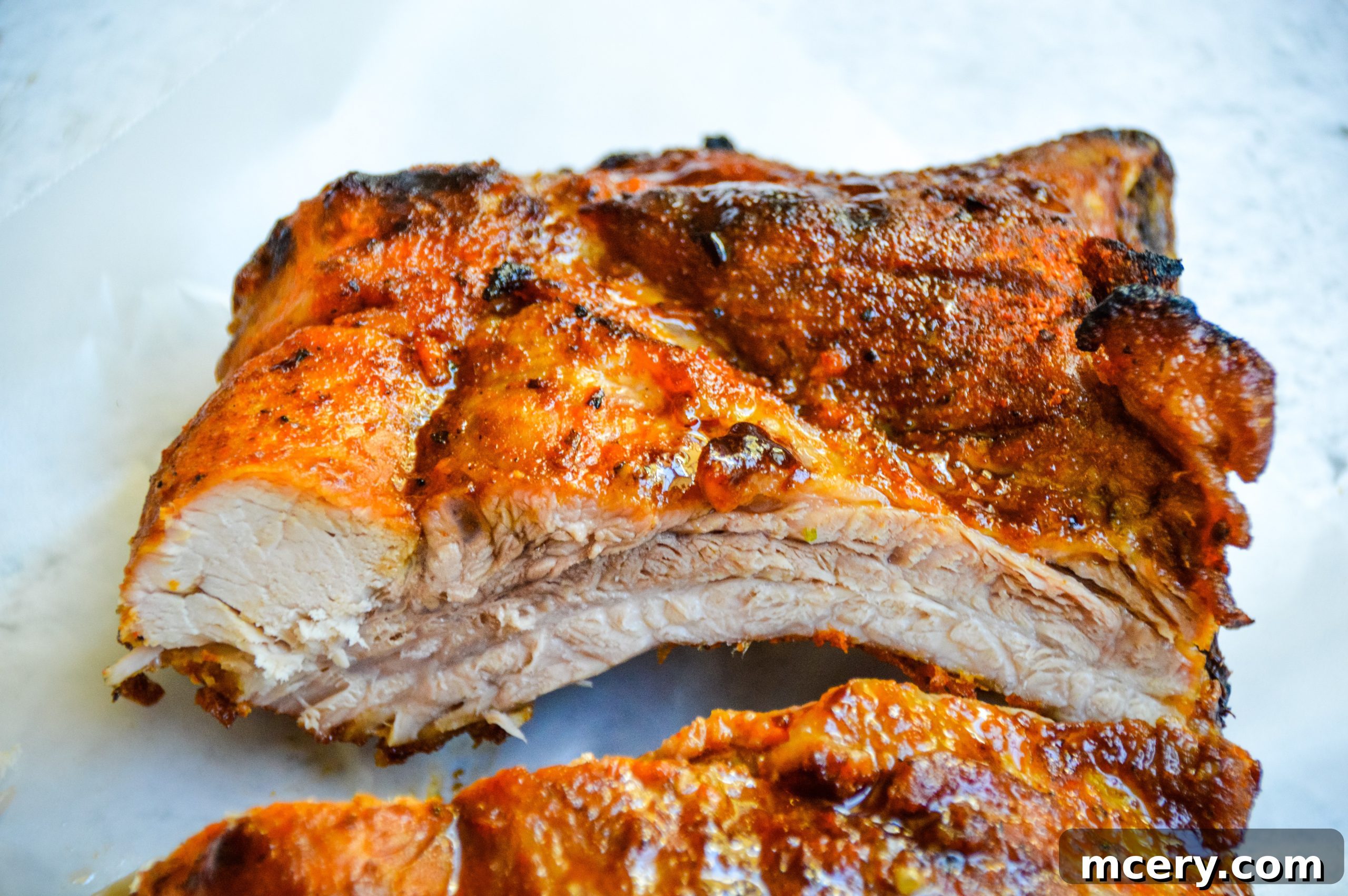 Paleo Rubbed Gas Grilled Pork Ribs 2 Perfectly grilled pork ribs with a delicious dry rub, ready for a summer BBQ.