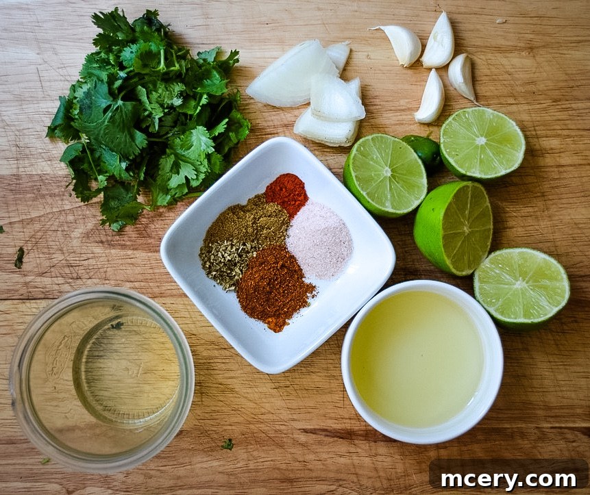 All the fresh ingredients for Tequila Lime Chicken marinade laid out on a cutting board.