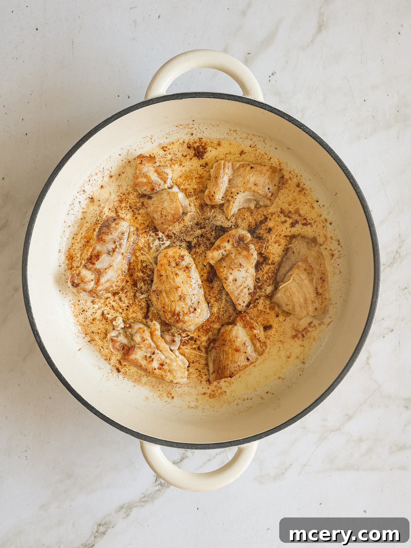 Your Guide to Perfect Marry Me Chicken 5 cooked chicken thighs in skillet.
