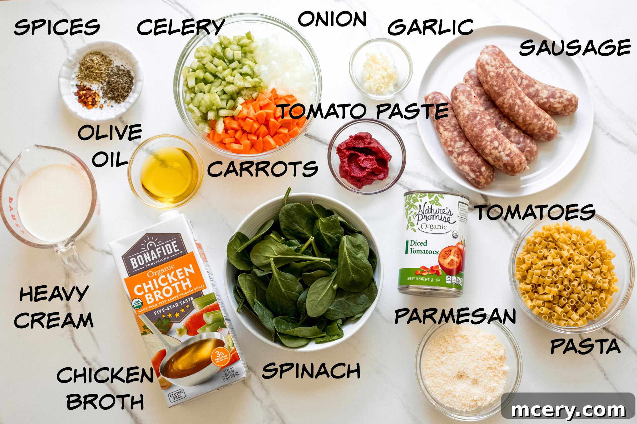 Hearty Italian Sausage Soup 3 A display of fresh ingredients for Italian sausage soup, including vegetables, spices, and sausage.