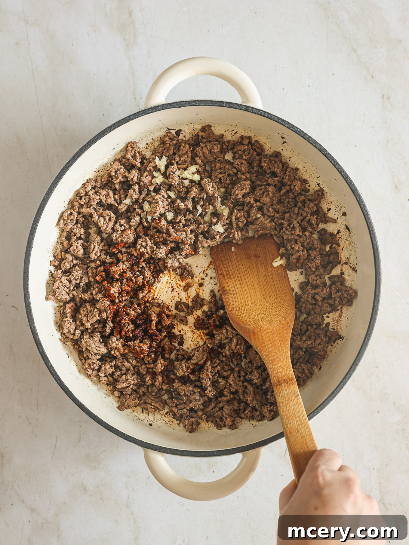 No-Fuss Beef Stroganoff 4 Crumbled and cooked ground beef with garlic and paprika in a skillet.
