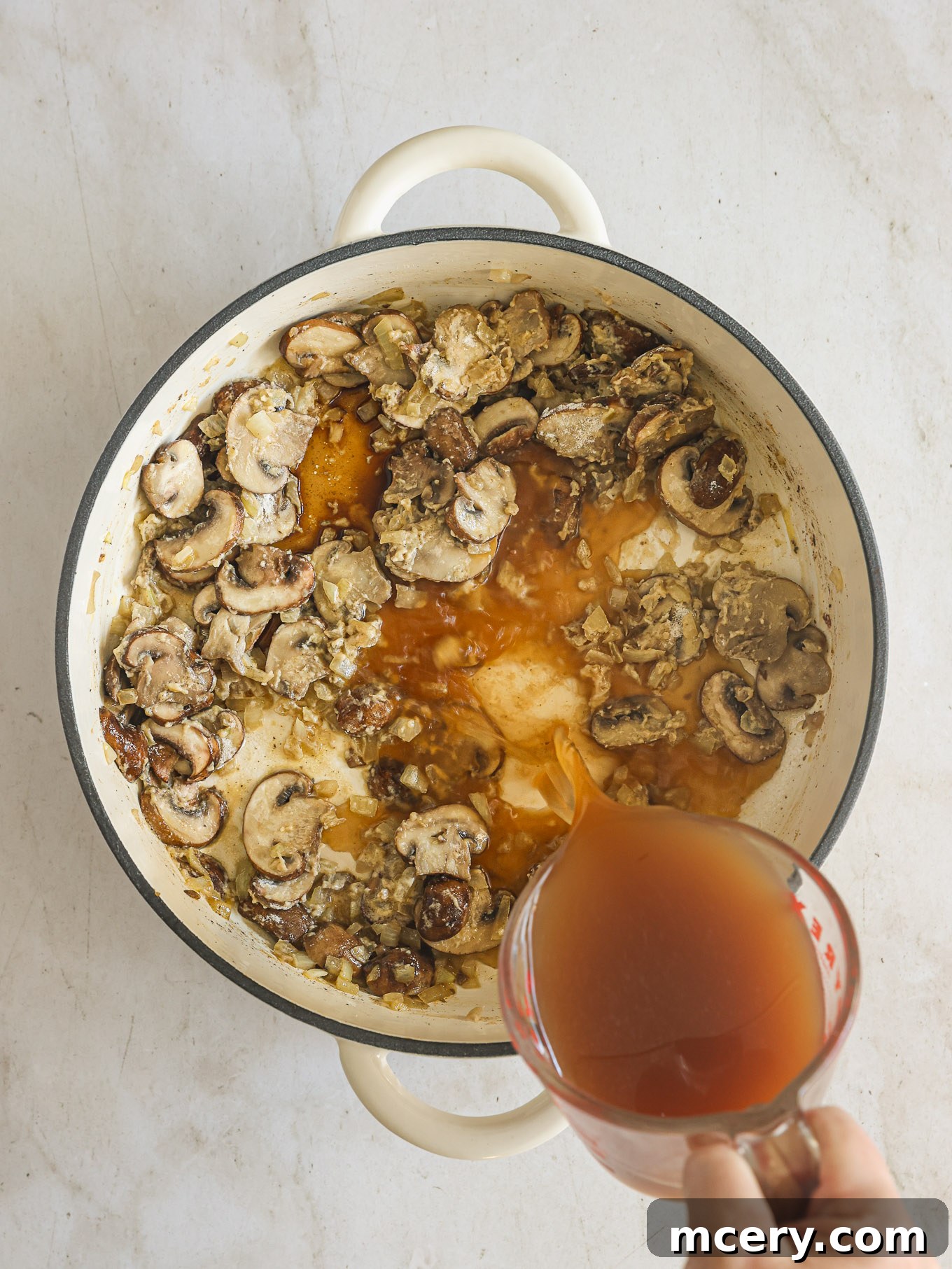 No-Fuss Beef Stroganoff 7 Beef broth and Worcestershire sauce added to the mushroom and onion mixture, simmering to thicken.