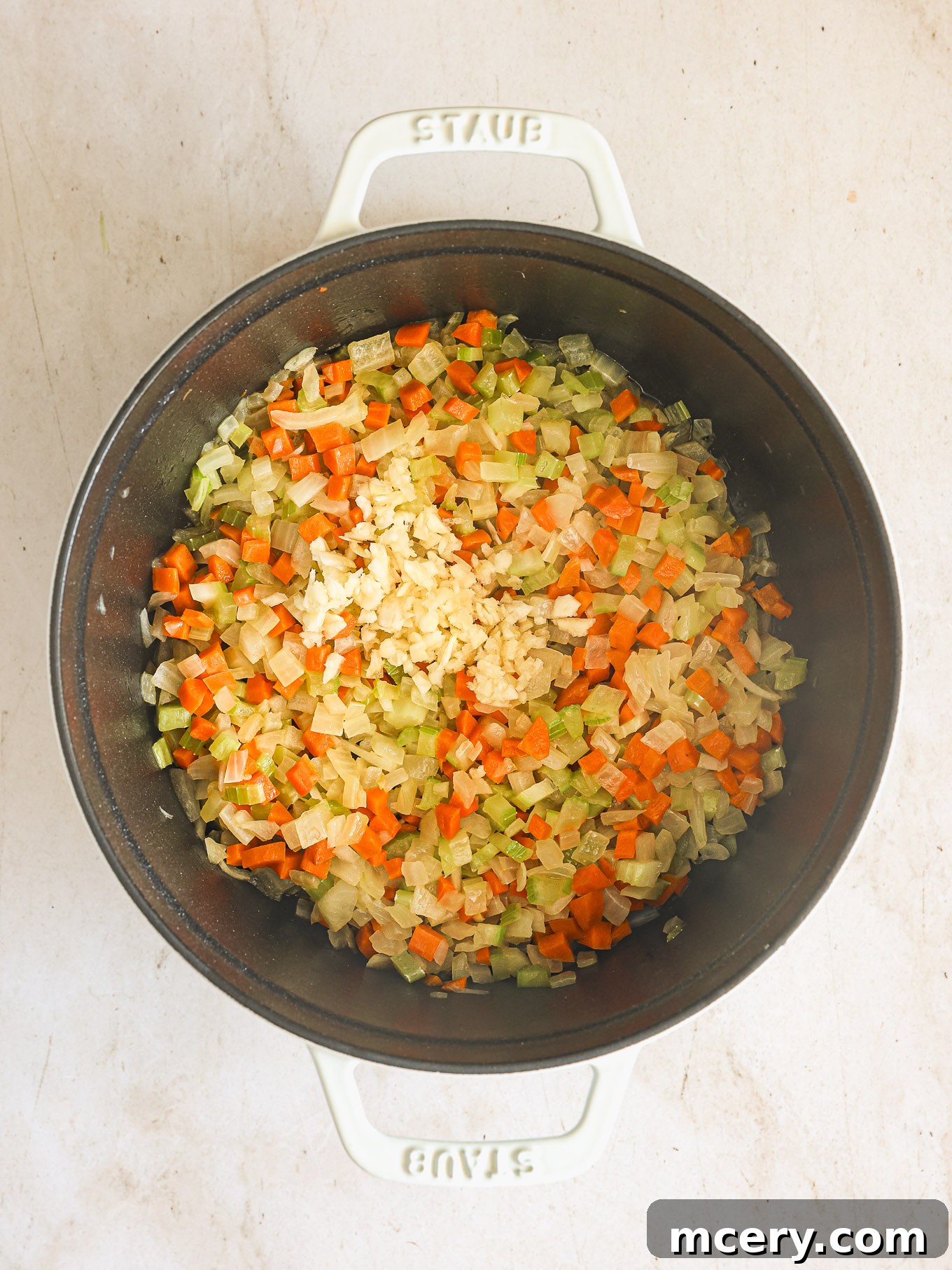 Classic Hearty Bolognese Pasta 4 sauted vegetables in a dutch oven.