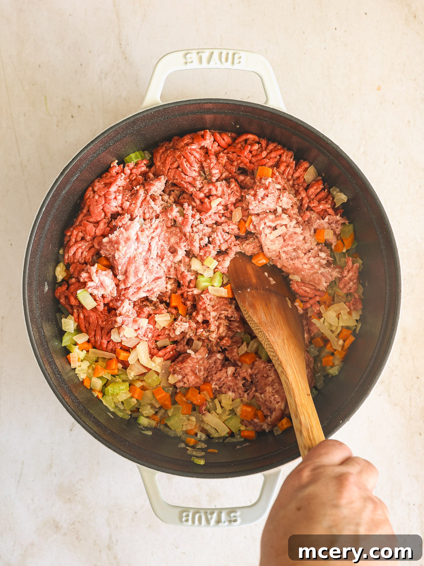 Classic Hearty Bolognese Pasta 5 ground beef and pork in a dutch oven.