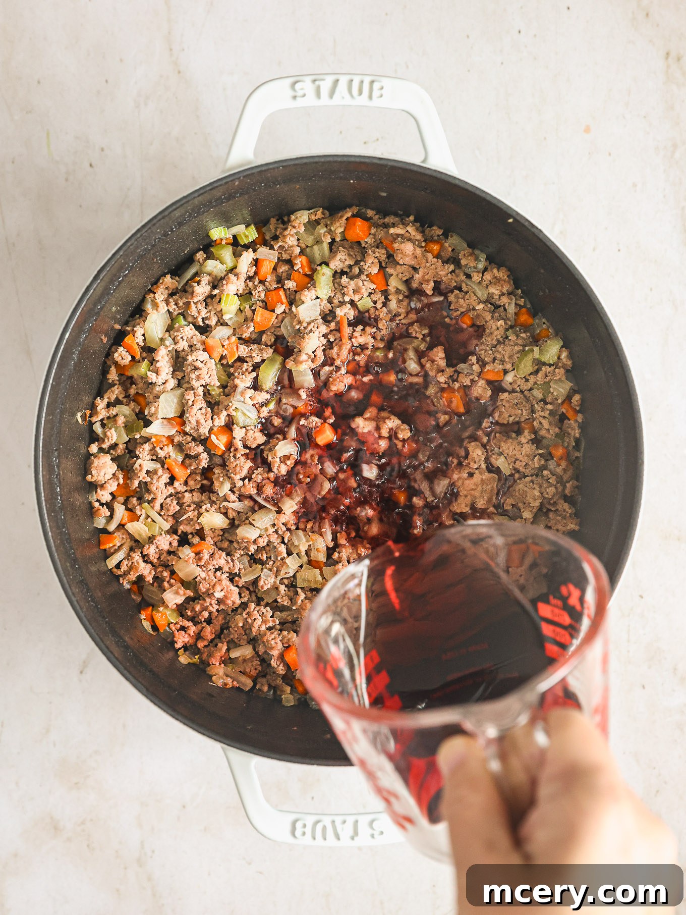 Classic Hearty Bolognese Pasta 6 wine with cooked vegetables and ground meat.