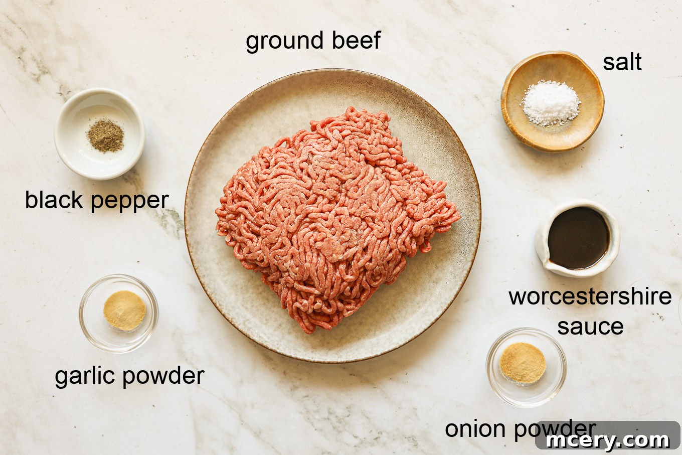 Crafting the Ultimate Homemade Burger 3 A bowl of fresh ground beef, a bottle of Worcestershire sauce, and small bowls of onion powder, garlic powder, salt, and pepper, all essential ingredients for homemade burgers.