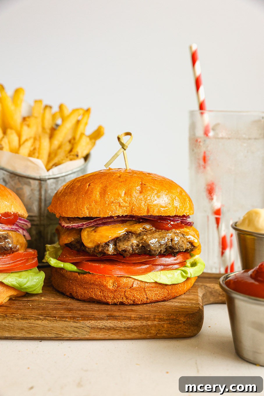 Crafting the Ultimate Homemade Burger 10 A beautifully presented homemade beef burger with fresh toppings on a wooden board, ready to be served.