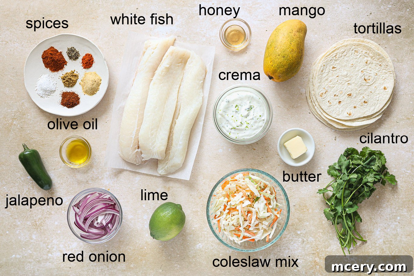 The Ultimate Homemade Fish Tacos 3 Variety of fresh ingredients for fish taco recipe including spices, fish fillets, and mango.