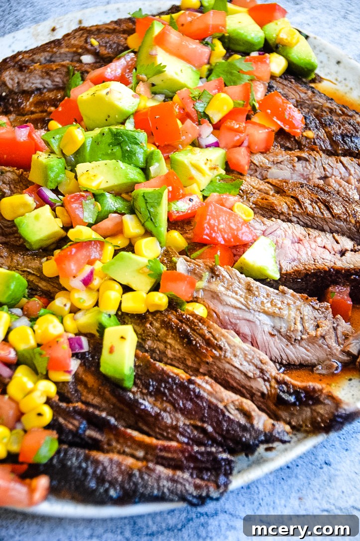 Spice Rubbed Flank Steak with Fresh Avocado Salsa 2 Grilled Flank Steak with Avocado Salsa on top