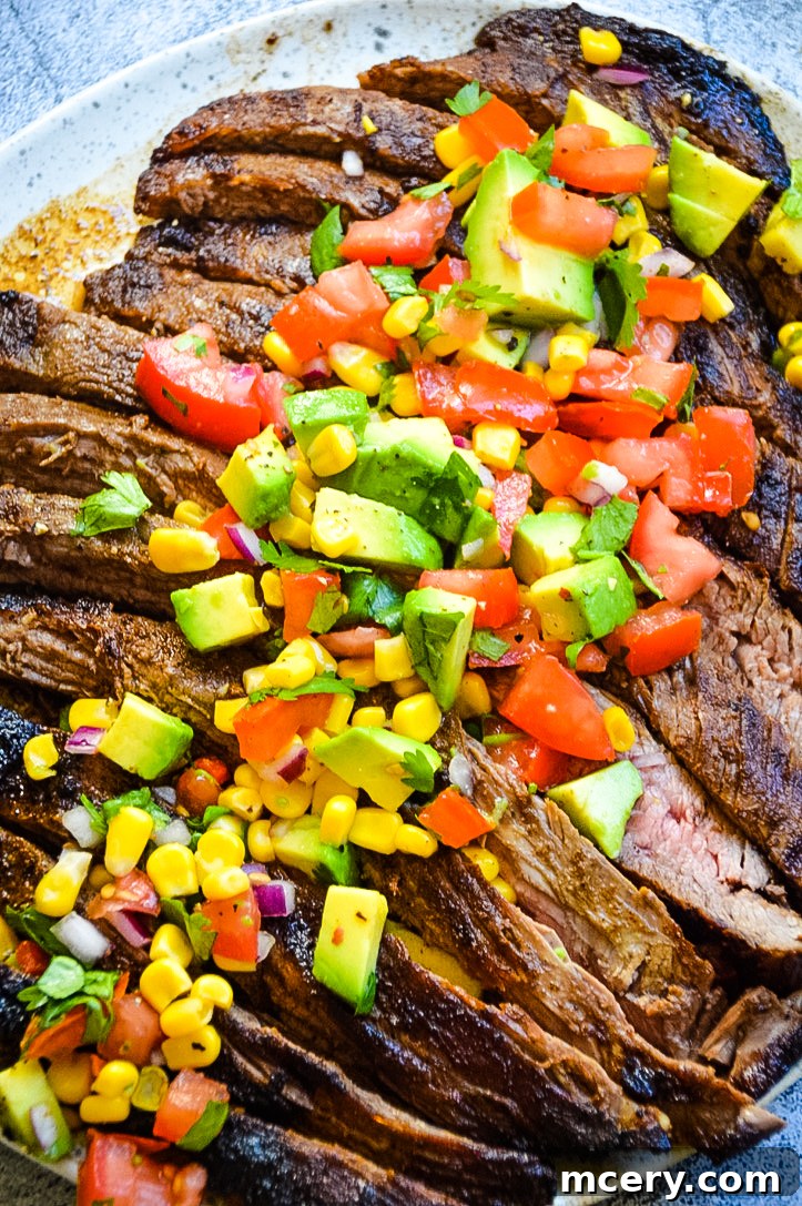 Spice Rubbed Flank Steak with Fresh Avocado Salsa 3 Slices of grilled flank steak next to a bowl of fresh avocado salsa