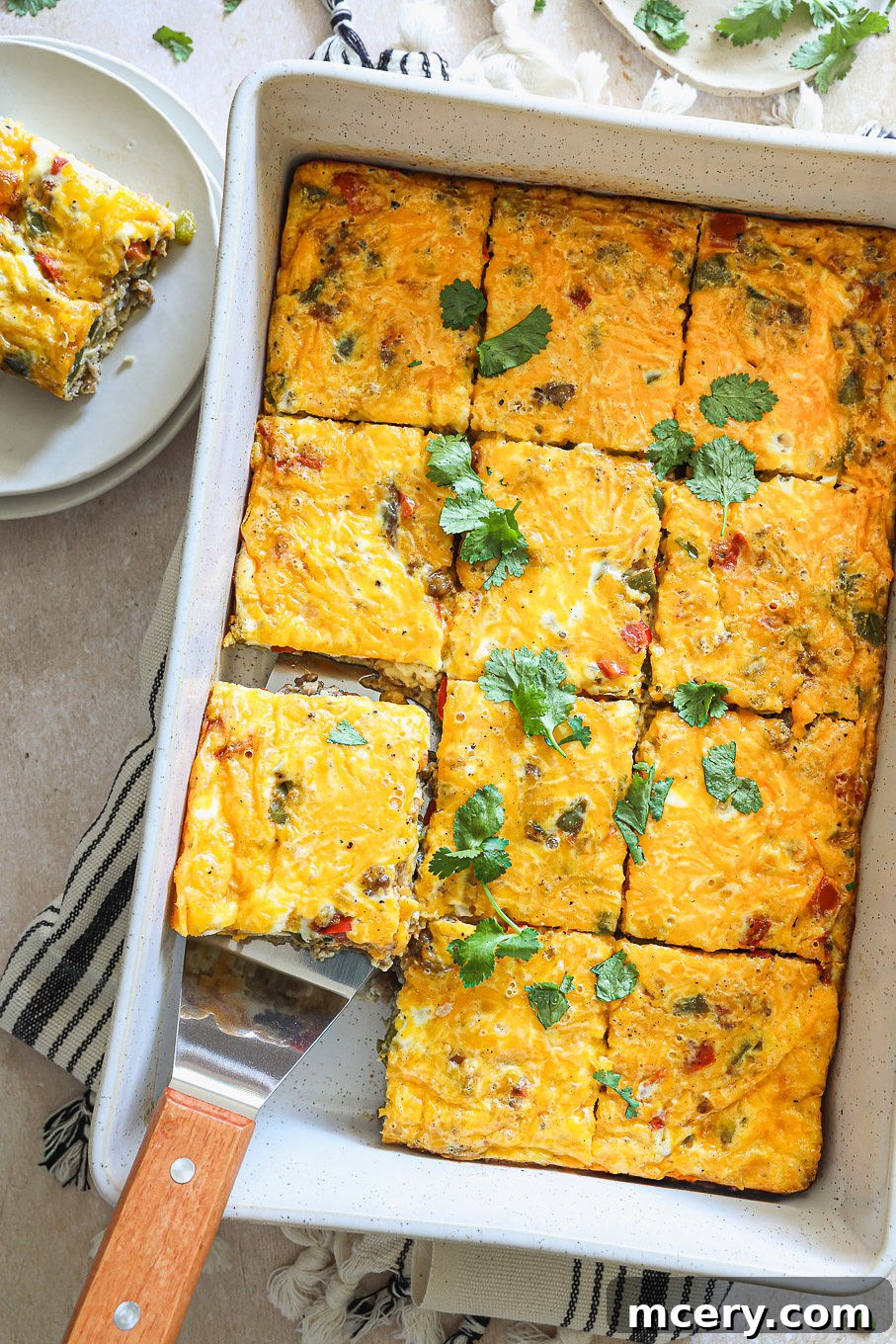Overnight Southwest Fiesta Bake 2 overhead of egg casserole with sausage and peppers, garnished with fresh cilantro.