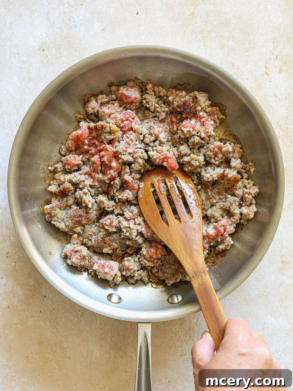 Overnight Southwest Fiesta Bake 4 cooked breakfast sausage in a skillet.