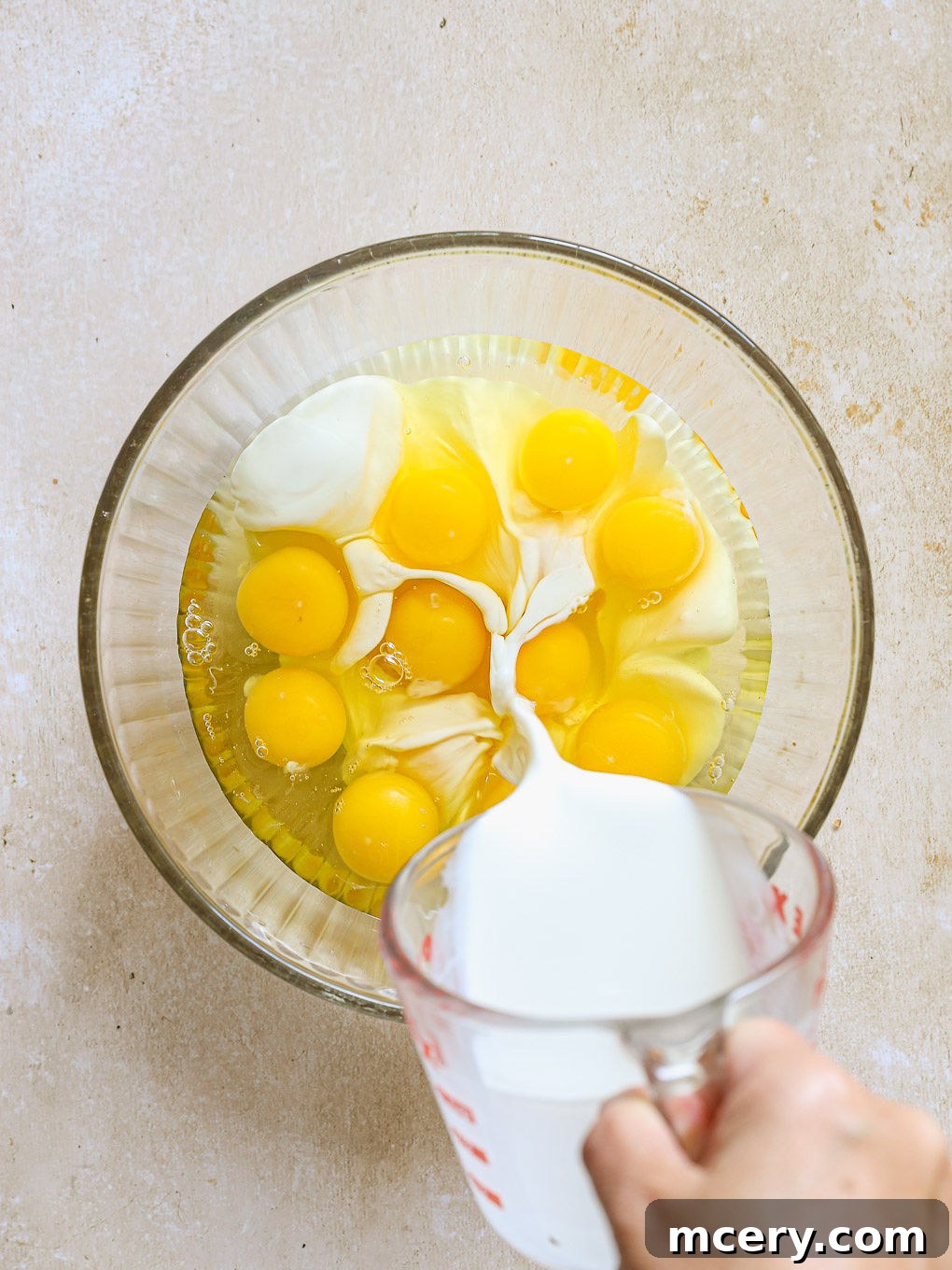 Overnight Southwest Fiesta Bake 6 eggs with cream in a glass bowl, whisked.