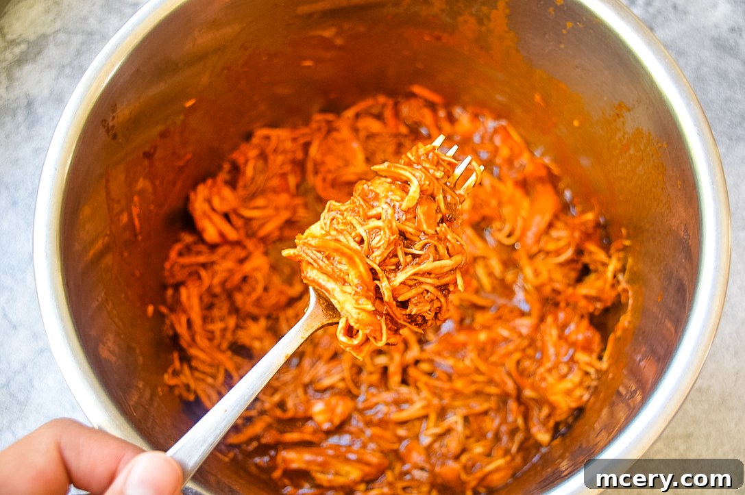 Smoky Pulled Chicken, Crisp Slaw, and Tangy Pickles 5 Ingredients for shredded BBQ chicken in an Instant Pot, including chicken breasts, BBQ sauce, and Italian dressing.