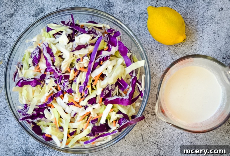 Smoky Pulled Chicken, Crisp Slaw, and Tangy Pickles 6 Ingredients for creamy homemade coleslaw dressing, including mayonnaise, Greek yogurt, lemon juice, agave, and apple cider vinegar.