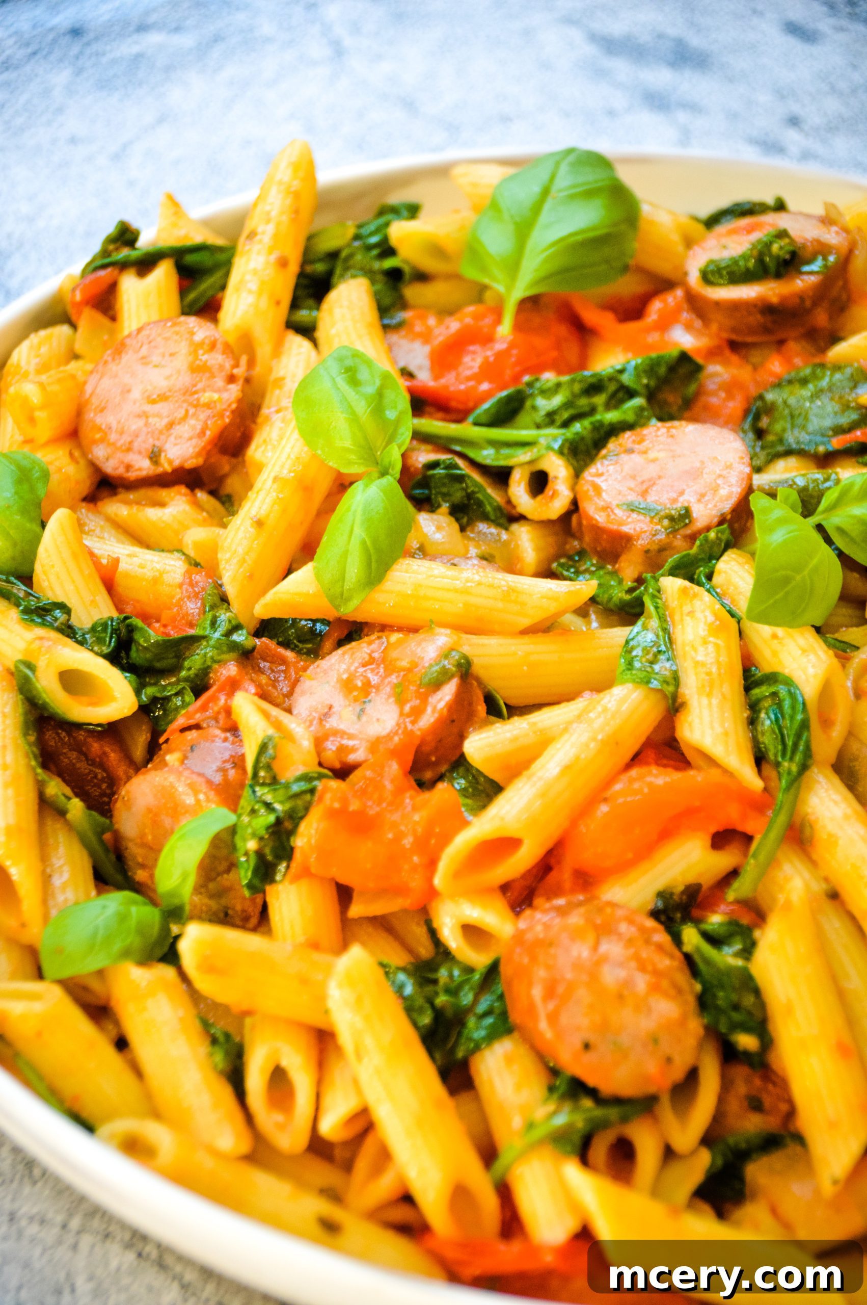 Hearty Tomato Spinach and Sausage Pasta 3 Close-up of the delicious Easy Tomato Spinach and Sausage Pasta, highlighting the fresh ingredients and rich sauce.