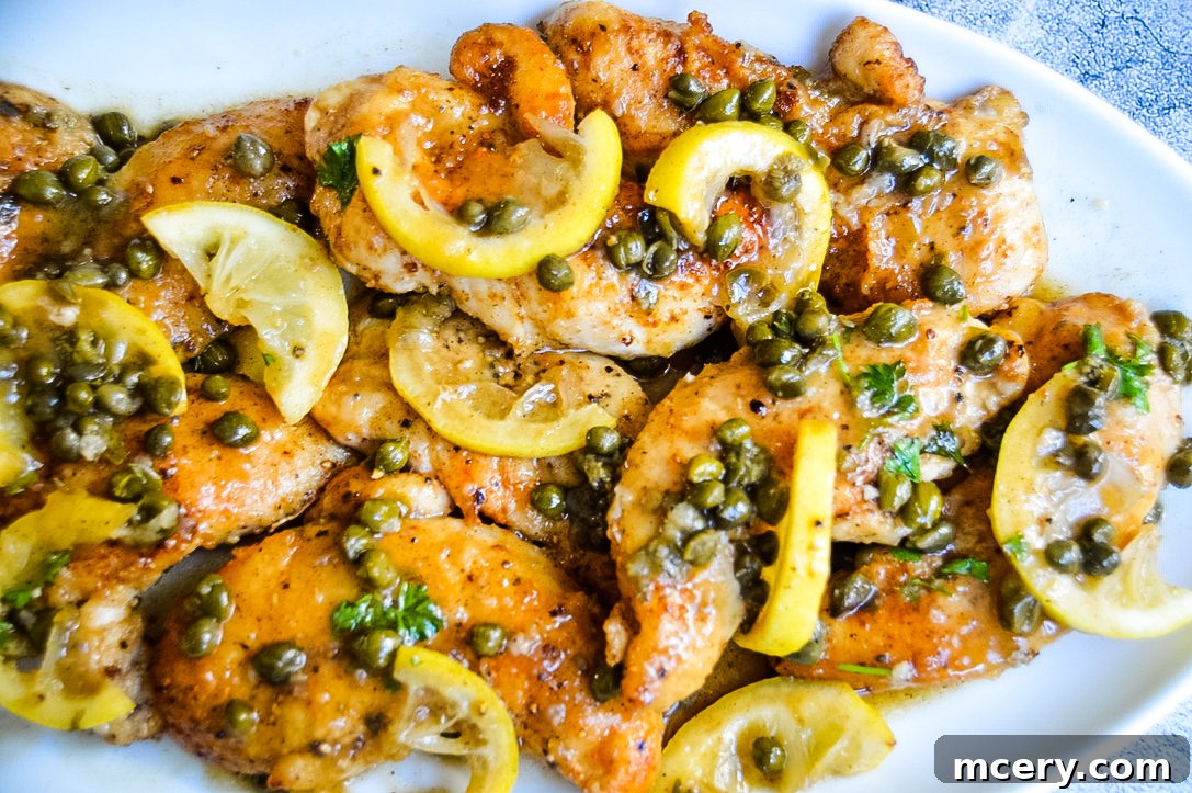 Effortless Chicken Piccata 4 A dish of Easy Chicken Piccata ready to be served, showcasing the golden-brown chicken and rich lemon caper sauce.