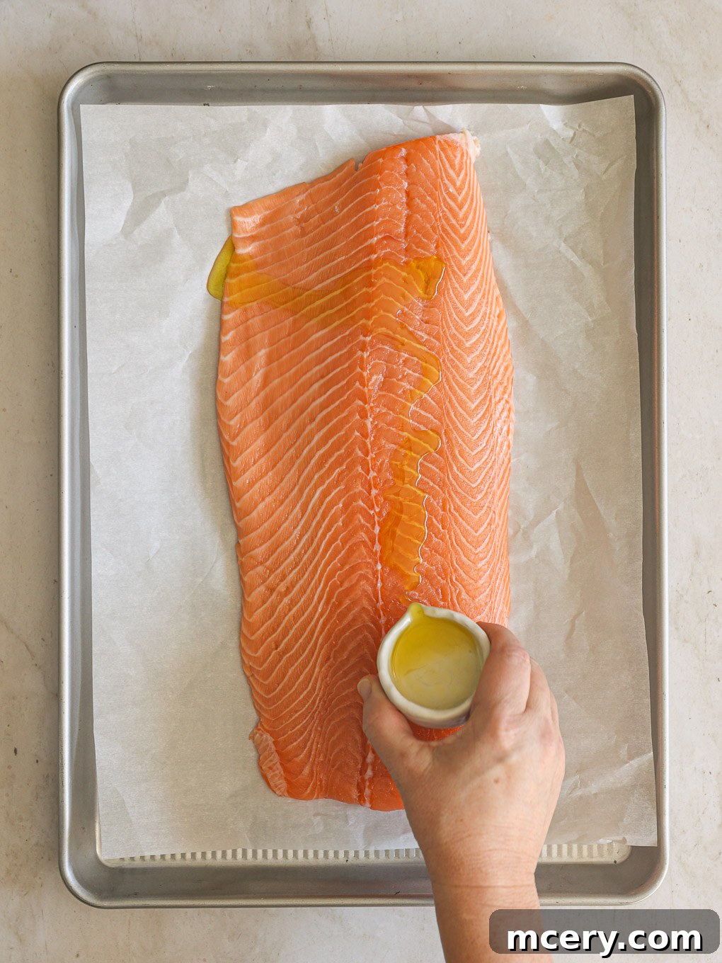 Unlock the Flavor Mastering Blackened Salmon 5 Salmon fillet glistening with a light coat of olive oil, ready for seasoning.