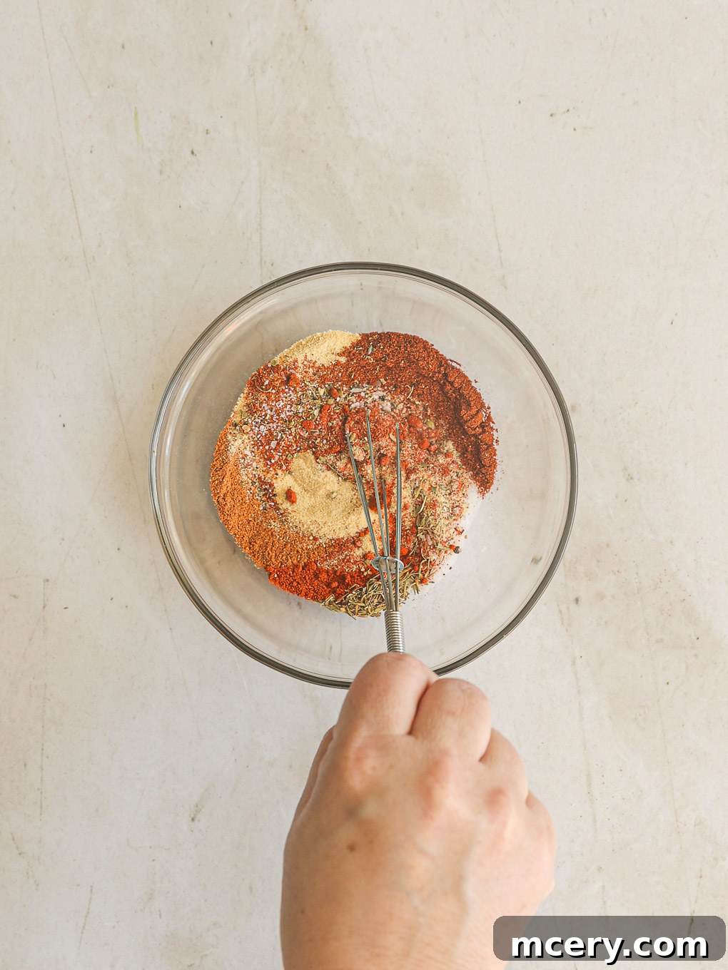 Unlock the Flavor Mastering Blackened Salmon 6 A small glass bowl filled with the vibrant homemade spice mixture, perfectly blended.
