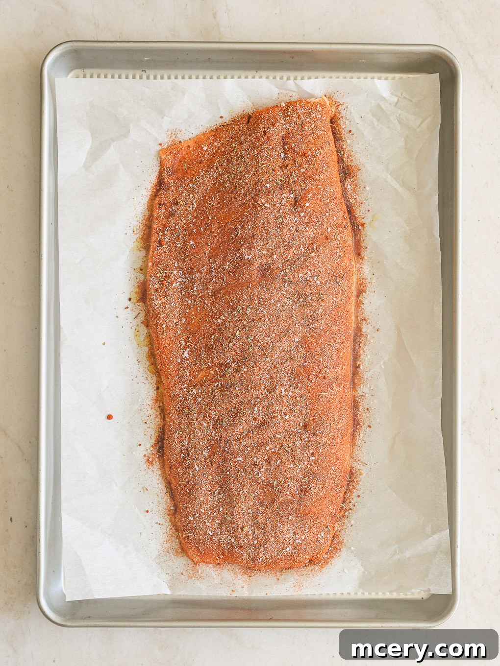 Unlock the Flavor Mastering Blackened Salmon 7 A salmon fillet generously coated in the dark, rich spice mixture, ready for baking.