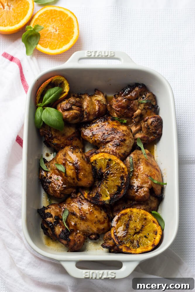 Effortless Orange Chicken 6 grilled chicken orange, showing plated grilled orange chicken garnished with fresh herbs