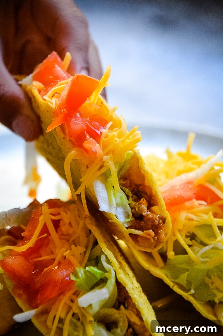Easy Instant Pot Ground Turkey Tacos 4 A rustic wooden board showcasing the core ingredients for Instant Pot Ground Turkey Tacos, including raw ground turkey, an assortment of colorful spices, fresh garlic and onion, and a can of tomato sauce, highlighting the natural and wholesome components of the recipe.
