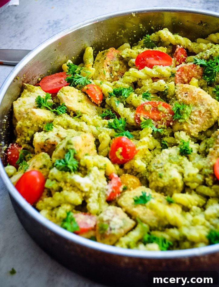 Emerald Pesto Chicken Pasta 2 Delicious creamy Chicken Pesto Pasta in a bowl, ready to serve.