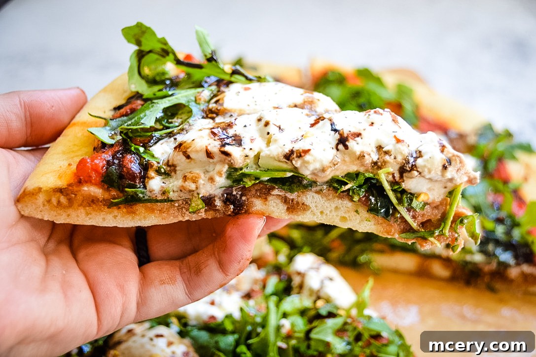 Sliced Burrata and Truffle Oil Pizza on a wooden board, ready to serve.