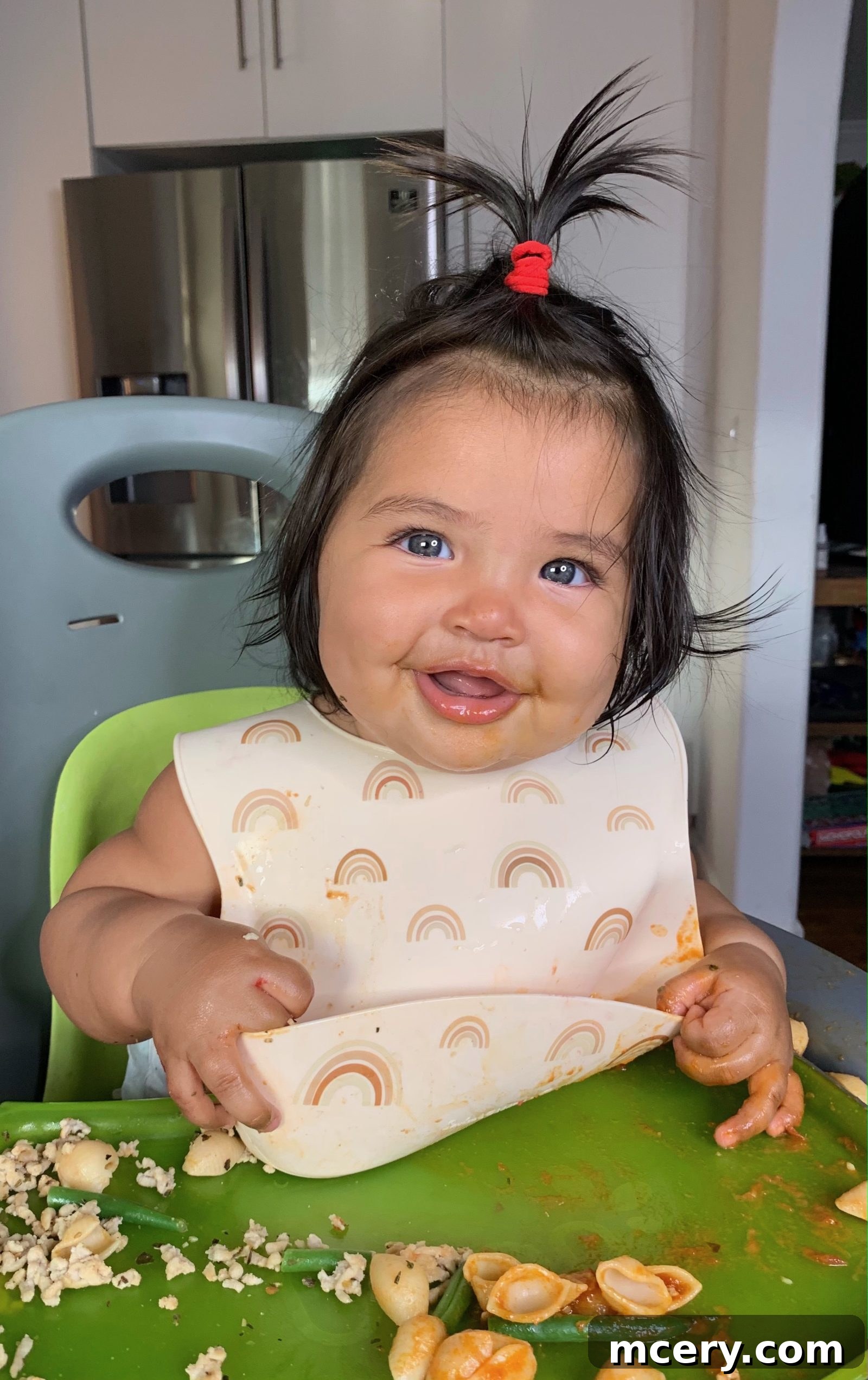 Your First Steps to Baby-Led Weaning 2 Smiling baby enjoying baby-led weaning