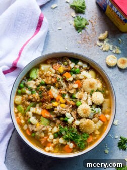 Maryland Crab Soup - hearty farmers market vegetables, lumps of crab meat, and spicy Old Bay seasoning