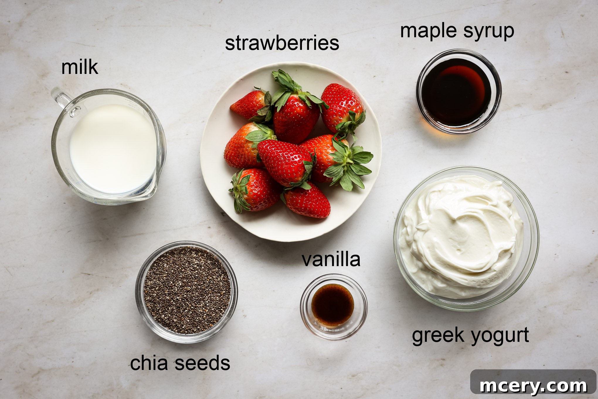 Delightful Strawberry Chia Pudding 3 Ingredients for chia pudding: milk, Greek yogurt, maple syrup, vanilla extract, chia seeds, and fresh strawberries.