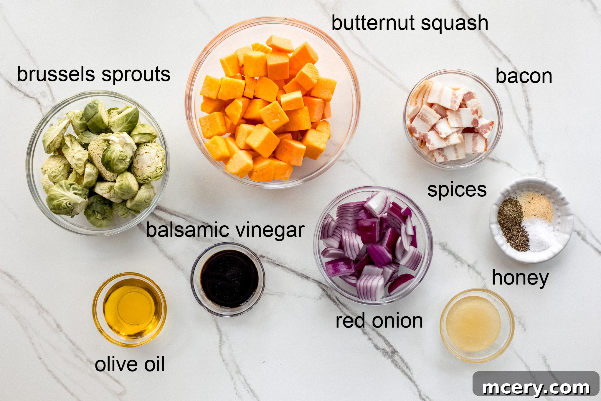 Autumn Roasted Bounty 3 Assortment of fresh ingredients for roasted fall vegetables recipe laid out on a table.